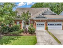 Charming brick home with well-manicured lawn and attached garage at 637 Botany Loop # 64, Murrells Inlet, SC 29576