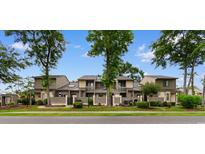 Inviting townhomes with manicured lawns, mature trees, and charming fenced patios, offering a cozy and private outdoor space at 620 15Th Ave. S # 87, Surfside Beach, SC 29575