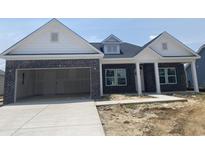 New construction home with a brick facade, white trim, and an attached two-car garage at 982 Oak Hollow St., Longs, SC 29568
