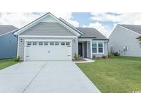 Charming single-story home with a two-car garage and well-manicured lawn at 1514 Saw Palmetto St., North Myrtle Beach, SC 29582