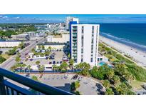 Beautiful exterior view of a white condo building with ocean views and parking at 2001 S Ocean Blvd. S # 1302, Myrtle Beach, SC 29577