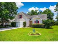Charming single Gathering home with a well-manicured lawn and attached two car garage at 4570 Fringetree Dr., Murrells Inlet, SC 29576