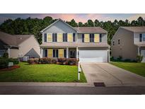 Charming two-story home boasts a well-manicured lawn, complemented by a two-car garage and inviting front porch at 2709 Eton St., Myrtle Beach, SC 29579