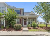 Charming two-story home with brick accents, beautiful landscaping, and a welcoming front door at 3017 Mercer Dr. # 0, Conway, SC 29526