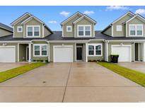 Inviting townhome featuring a one-car garage and well-maintained green space at 623 Harrison Mill St. # 623, Myrtle Beach, SC 29579