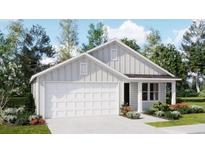 Charming single-story home with a two-car garage, well-manicured lawn, and beautiful landscaping at 6335 Swainson Street Sw, Ocean Isle Beach, NC 28469