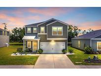 Charming two-story home featuring a two-car garage, landscaped front yard and covered entry at 788 Dusty Pine Way, Myrtle Beach, SC 29588