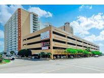 Sands Ocean Club building featuring a parking garage and signage at 9550 Shore Dr. # 225, Myrtle Beach, SC 29572