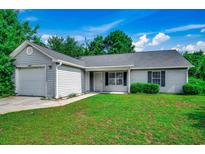 Charming single-story home with gray siding, well-maintained lawn, and attached one car garage at 1836 Juniper Dr., Conway, SC 29527