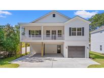 Beautiful two-story home with a charming front porch, nice driveway, and a one car garage at 2428 Park St., North Myrtle Beach, SC 29582