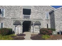 A charming condo complex featuring well-maintained brick facade and inviting entrance at 4719 Cobblestone Dr. # C4, Myrtle Beach, SC 29575
