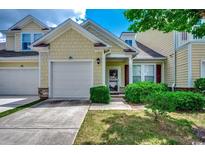 Charming two-story home featuring a one car garage and well-maintained landscaping at 100 Culpepper Way # 1002, Myrtle Beach, SC 29579
