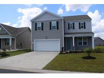 Two-story home with gray siding, black shutters, a two-car garage, and a manicured front lawn at 161 Londonshire Dr., Myrtle Beach, SC 29579