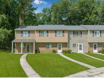 Inviting townhouse with well-manicured lawn and traditional facade nestled in a residential community at 178 Beaver Pond Loop # 60, Pawleys Island, SC 29585