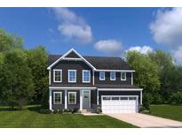 Charming two-story home boasts a well-manicured lawn, complemented by lush trees and bright, multi-paned windows at 2273 Hazel Way, Longs, SC 29568