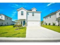 Charming two-story home with a manicured lawn and a two-car garage at 2325 Copper Creek Loop, Longs, SC 29568