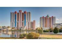 Bright view of the colourful exteriors of two modern buildings sitting beside the water under a clear blue sky at 3601 N Ocean Blvd. # 1139, North Myrtle Beach, SC 29582