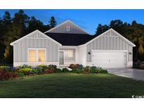 Charming one-story home featuring gray siding, a two-car garage, and beautifully landscaped front yard at 4887 Hopespring St., Myrtle Beach, SC 29579