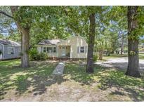 Charming single-story home with a lush, tree-filled front yard and inviting curb appeal at 602 3Rd Ave. N, Myrtle Beach, SC 29577