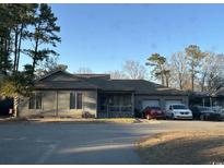 Charming single-story home featuring a two-car garage and inviting front porch at 814 James Landing Ct., Murrells Inlet, SC 29576