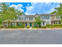 Charming townhomes featuring colorful doors, manicured landscaping, and inviting curb appeal at 1025 Penny Ln. # 1025, Myrtle Beach, SC 29577