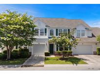 Charming two-story home with attached garages, beautiful trees, and lovely landscaping at 310 Lockerbie Ct. # 1057, Myrtle Beach, SC 29577