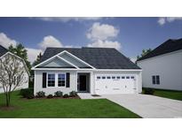 Charming single-story home featuring a two-car garage, well-maintained lawn, and inviting curb appeal at 339 Garden Grove St, Conway, SC 29526