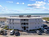 Three story condo building with ocean view, ample parking and beach access for easy enjoyment at 5000 N Ocean Blvd. # E-2, North Myrtle Beach, SC 29582