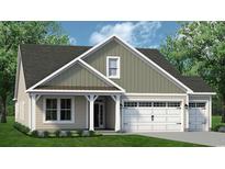 Charming single-Gathering home featuring a covered porch, a two-car garage, and professionally landscaped front yard at 1243 Halter Pl., Calabash, NC 28467