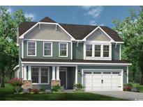 Charming two-story home featuring a welcoming front porch, complemented by an attached two-car garage at 1247 Halter Pl., Calabash, NC 28467