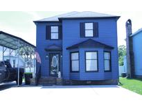 Charming blue two-story home with an American flag and manicured landscaping at 1557 Elizabeth Rd., Myrtle Beach, SC 29577