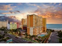 Expansive oceanfront hotel with outdoor pool and ocean views at sunset at 6900 N Ocean Blvd. # 842, Myrtle Beach, SC 29577