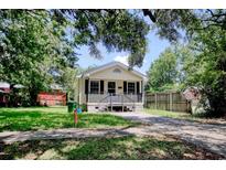 Charming single-story home featuring a cozy front porch and classic black shutters at 1028 Duke St., Georgetown, SC 29440