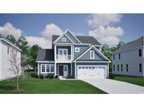 Charming two-story home featuring blue siding, white trim, and a welcoming two-car garage at 1088 Laconic Dr., Myrtle Beach, SC 29588