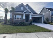 Charming single-Gathering home with brick accents, a well-manicured lawn, and an attached carport at 2256 Vera Way, Longs, SC 29568