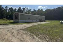 Exterior view of single Gathering home featuring modern siding and a spacious front yard at 364 Jamie Rd., Galivants Ferry, SC 29544