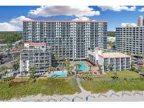 Stunning aerial view of a beachfront resort featuring multiple pools and well-manicured grounds at 7200 N Ocean Blvd. # 459, Myrtle Beach, SC 29572