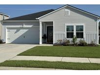 Charming single-Gathering home with attached garage, well-manicured lawn, and inviting curb appeal at 8164 Forest Edge Dr., Myrtle Beach, SC 29579