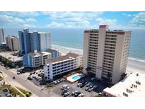 Stunning aerial view of oceanfront condo complex with ocean views at 912 N Waccamaw Dr. # 202, Garden City Beach, SC 29576