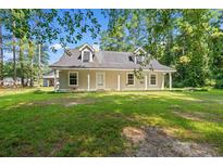 Charming single-story home featuring dormer windows and a cozy covered front porch at 938 Fox Hollow Rd., Conway, SC 29526