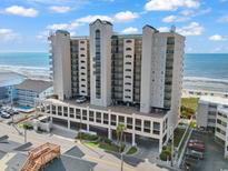Stunning aerial view of a beachfront condo with parking and beautiful ocean views at 1003 S Ocean Blvd. # 802, North Myrtle Beach, SC 29582