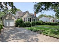 Charming single-story home with a well-manicured lawn and driveway, with mature trees adding shade at 1024 Palmetto St., Georgetown, SC 29440