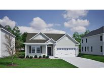 Charming single-Gathering home with a two-car garage, beautiful landscaping, and traditional architectural details at 1084 Laconic Dr., Myrtle Beach, SC 29588