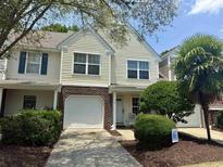 Charming townhome with a single-car garage and well-maintained landscaping in a desirable community at 112 Palisade Loop # 112, Pawleys Island, SC 29585