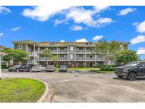 Multi-level condo with well-manicured landscaping, convenient parking, and multiple balconies at 300 Kiskadee Loop # K, Conway, SC 29526