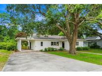 Charming single-story home with covered parking, mature trees, and well-maintained landscaping at 4325 Ellis Ave., Little River, SC 29566