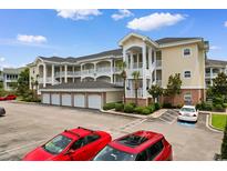 Spacious condo building featuring multiple floors, private garage, and ample parking space at 4872 Dahlia Ct. # 305, Myrtle Beach, SC 29577