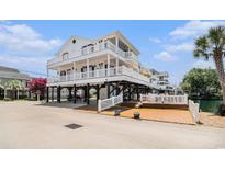 Beautiful multi-level beach house featuring multiple decks and ample outdoor living space on the water at 6001-R11 S Kings Hwy., Myrtle Beach, SC 29575