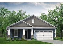Charming single-story home boasts a two-car garage, covered porch, and attractive landscaping at 628 Millbrook Way, Loris, SC 29569