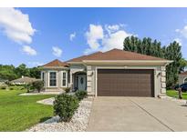 Charming single-story home featuring a manicured lawn, well-kept landscaping, and a two-car garage at 668 Barona Dr., Myrtle Beach, SC 29579